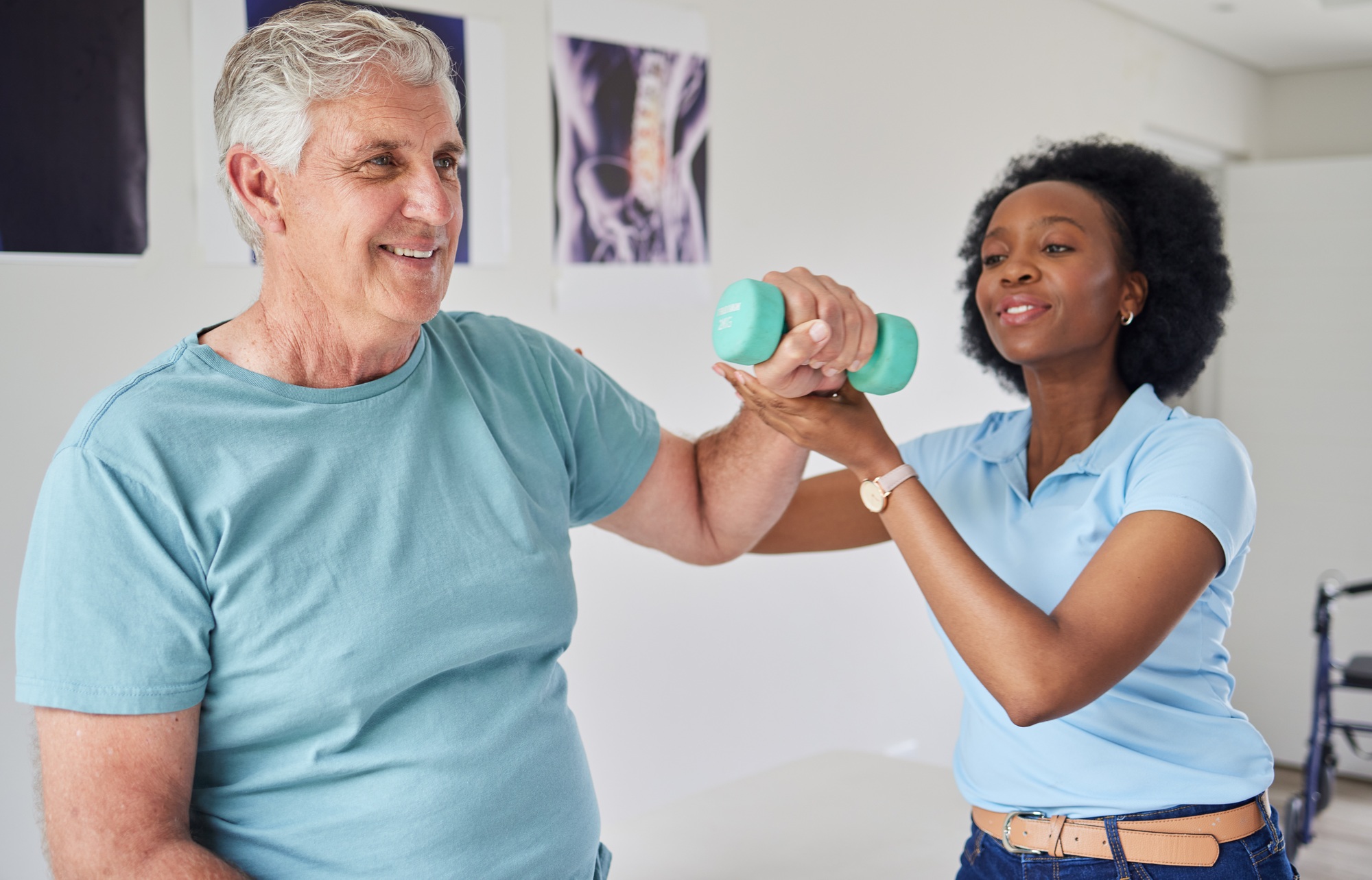 Black woman, help and senior man with dumbbells with training or workout at clinic. Physical therap