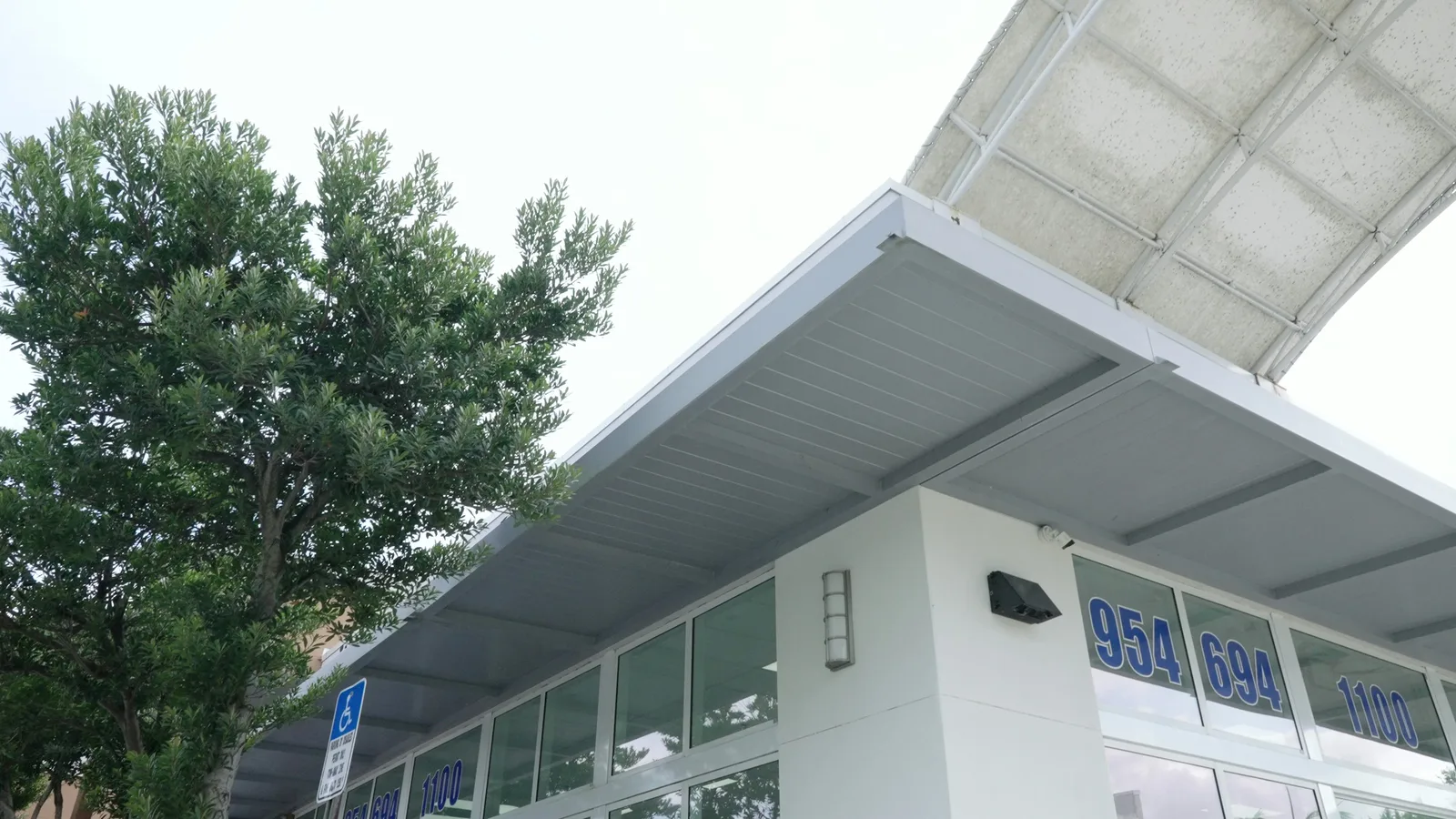 Exterior of Tamarac Senior Center at 6570 N University Dr, with the center's phone number on the front windows